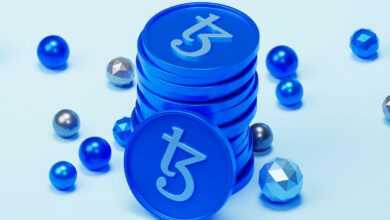 a stack of blue tokens sitting on top of a table