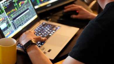 man sitting in front of the laptop