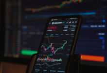 black android smartphone on brown wooden table