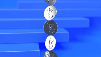 a group of three metal numbers sitting on top of a blue surface
