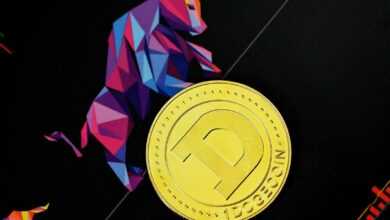 a close up of a gold coin on a black surface