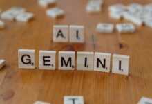 A wooden table topped with scrabble tiles that spell out the word all gen