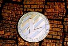 silver and black round analog wall clock